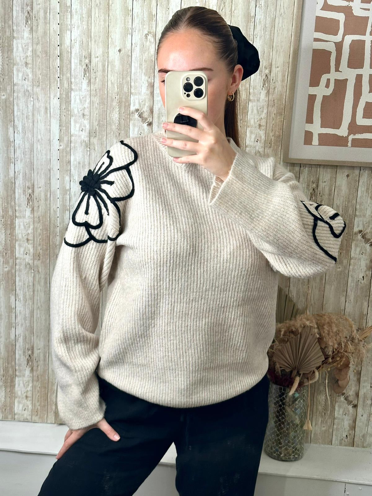 Beige soft jumper with black flower embroidery